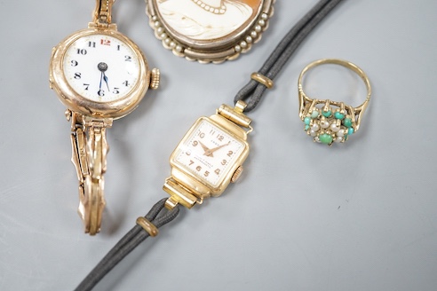 A lady's early 20th century 9ct gold manual wind wrist watch, on a 9ct strap, gross 16.4 grams, a lady's 18k watch, gross 9.9 grams, a cameo brooch and a 9ct dress ring.